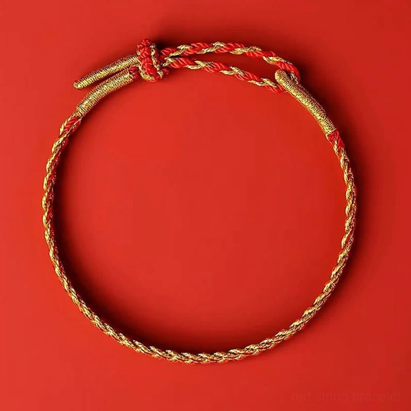Red and yellow woven bracelet with adjustable knot showing traditional Eastern blessing and fate thread design