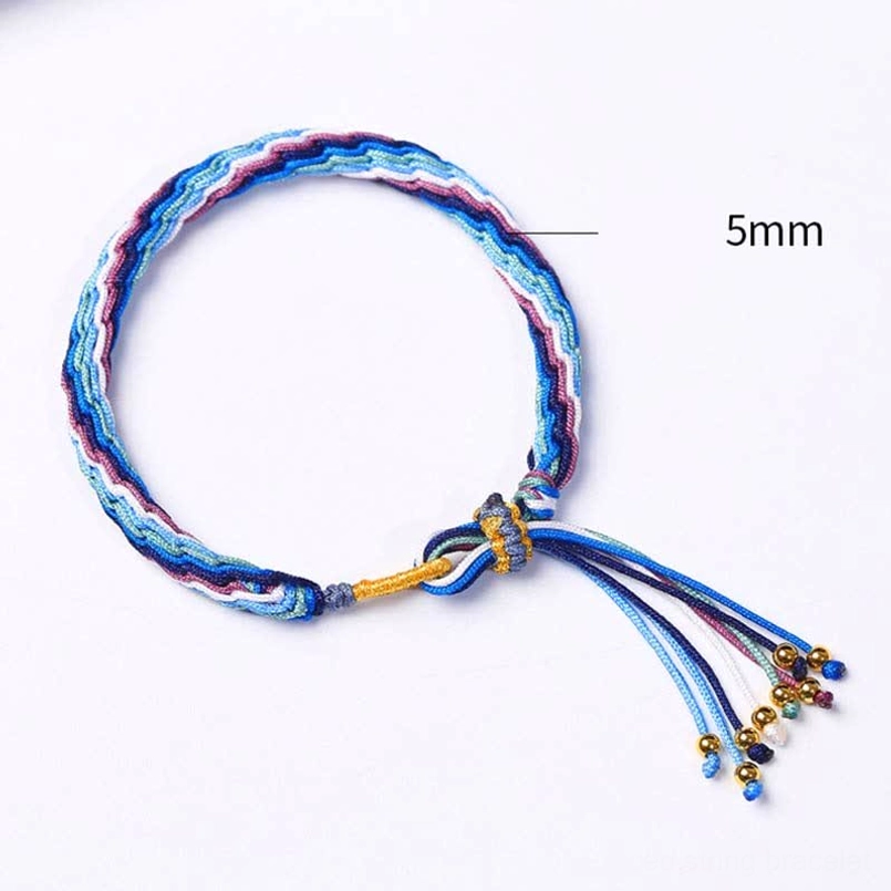 Reincarnation knot bracelet with 5mm size scale reference and blue-purple weave showing precise craftsmanship