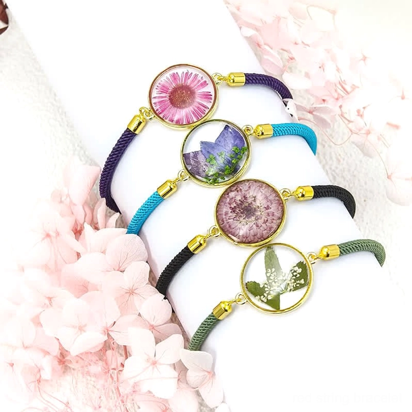 Rose birth flower bracelet - red string with resin-encased rose charm