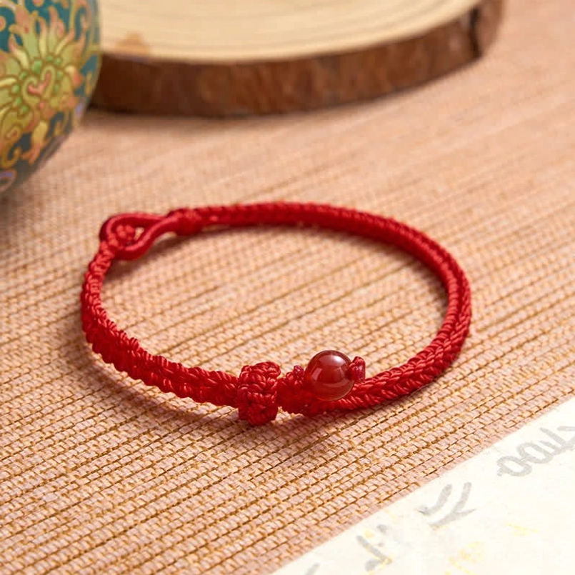 Rose quartz red string bracelet love and compassion symbol detail