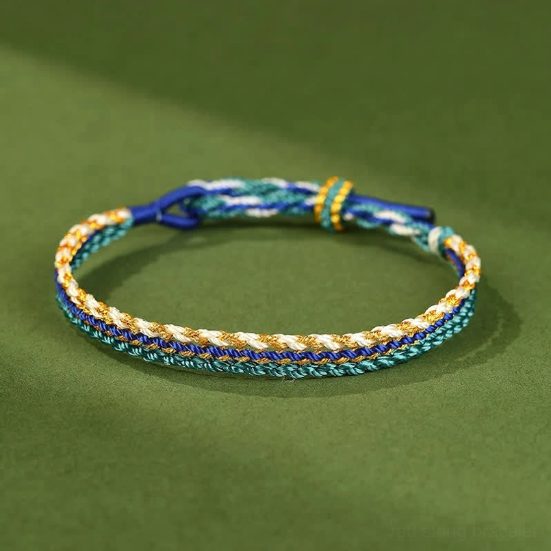 Royal blue handwoven string bracelet displayed flat with natural materials on green backdrop