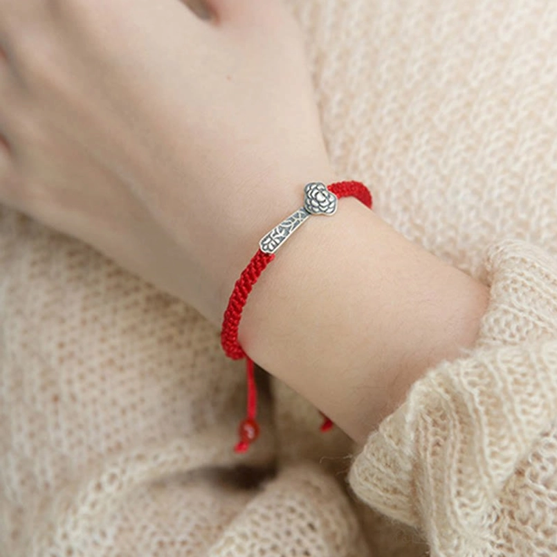 Red agate bead detail on adjustable Ruyi red string bracelet highlighting natural stone and silver craftsmanship