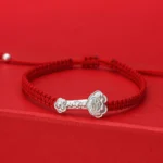 999 Sterling Silver Ruyi Fu Red String Bracelet - Front Three-Quarter View with Braided Red Cord and Polished Silver Charm