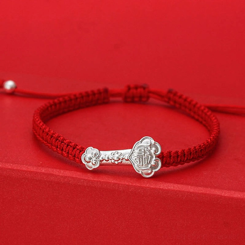 999 Sterling Silver Ruyi Fu Red String Bracelet - Front Three-Quarter View with Braided Red Cord and Polished Silver Charm