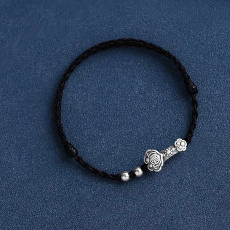 Red String Ruyi Fu Charm Bracelet - Flat Lay Product Photography