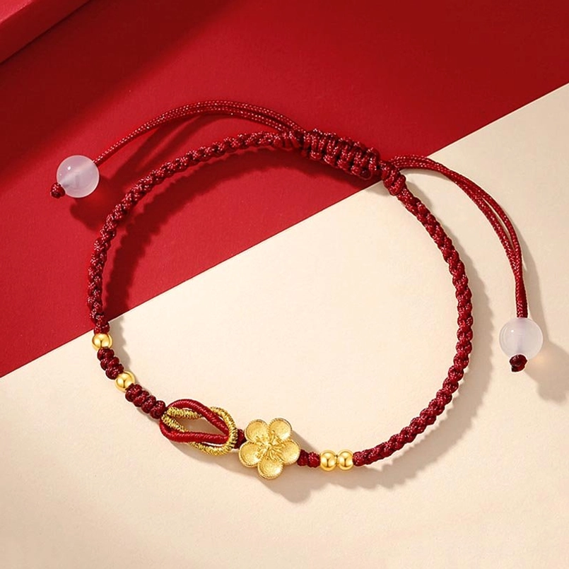 Sakura red cord bracelet top down flat lay split red beige background adjustable closure