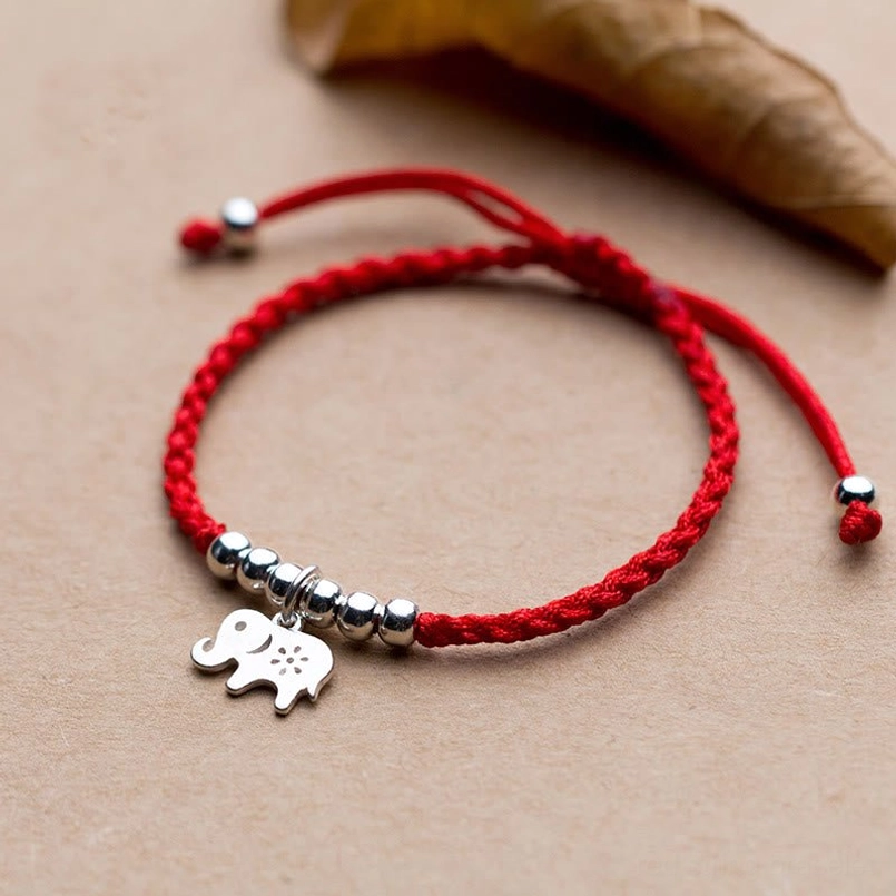 925 sterling silver elephant red string protection bracelet top view with dry leaf