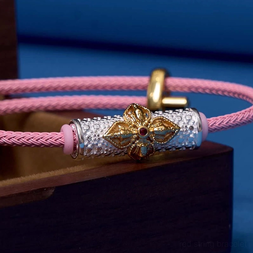 Silver gold flower pink string luck bracelet showing handcrafted quality