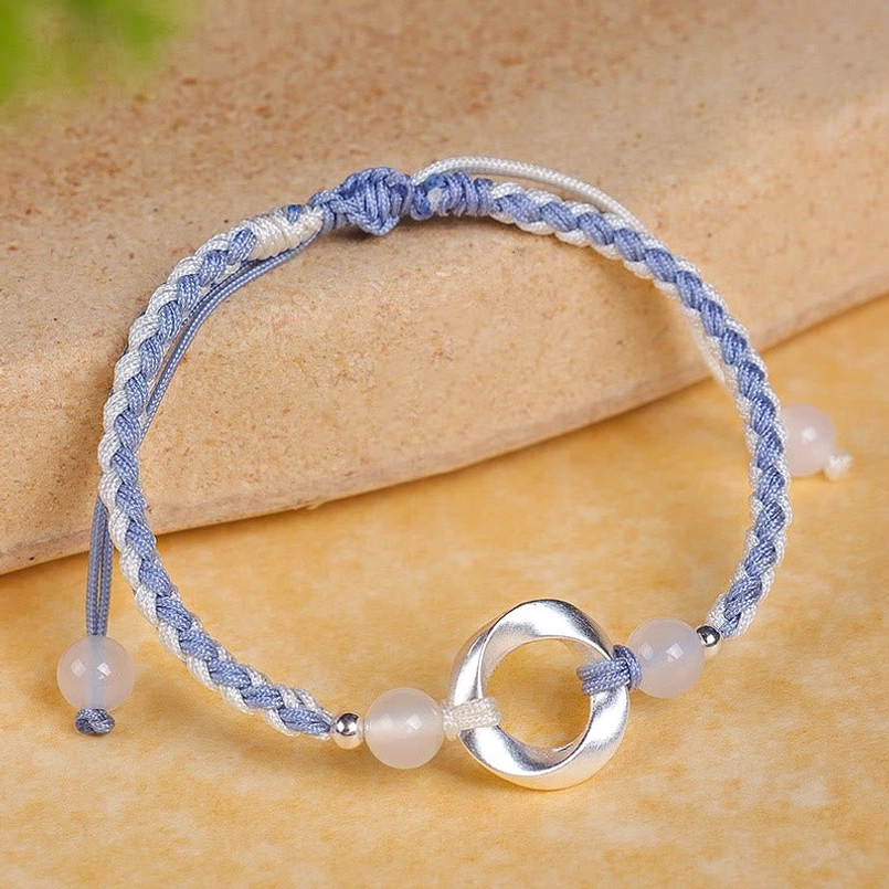 925 sterling silver Möbius white agate bracelet with blue braided string, adjustable protection bracelet top view