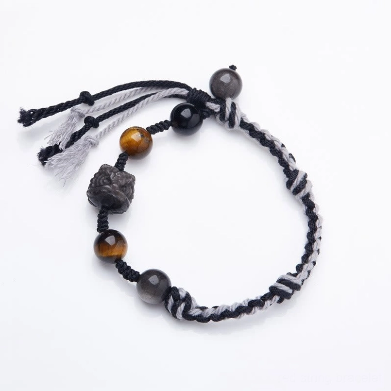 Silver sheen obsidian tiger eye red string bracelet flat lay on white background