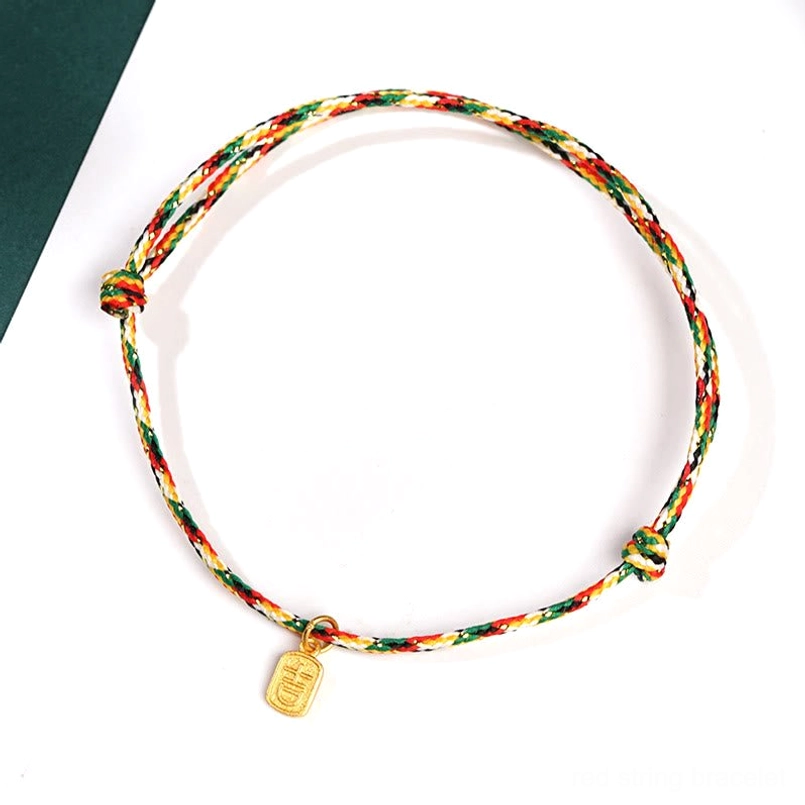 Single multicolor braided auspicious lucky red string bracelet flat view on white background