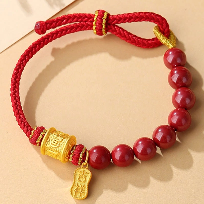 Six True Words blessing bracelet, close-up of natural cinnabar beads and sterling silver charm