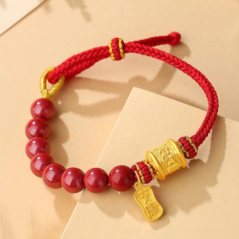 Six True Words blessing bracelet with red braided cord, cinnabar beads, and adjustable silver knot