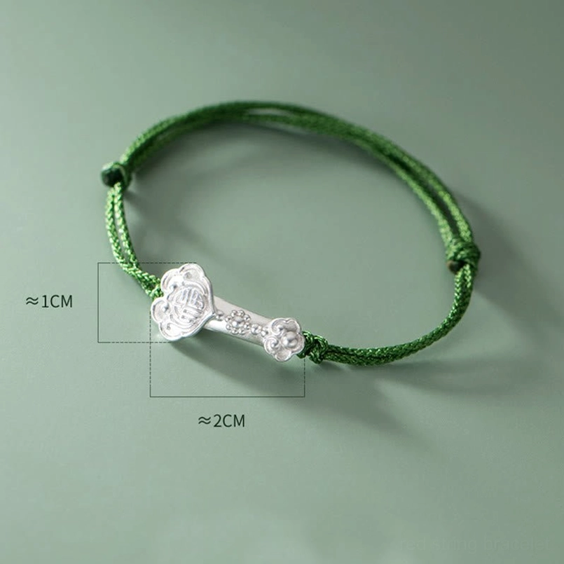 Size reference view of 999 sterling silver ruyi fu charm for green braided bracelet
