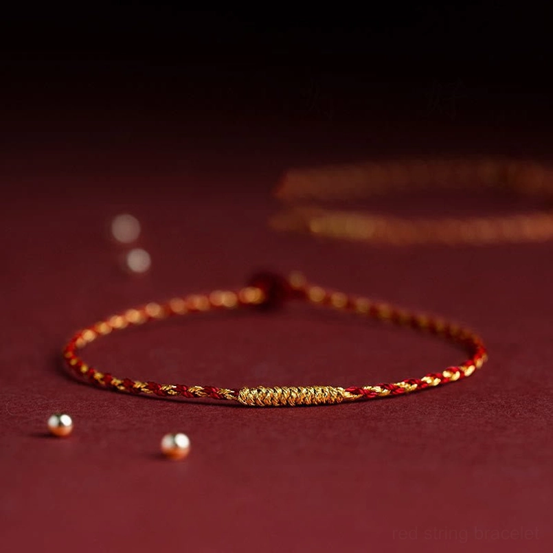 Slim red braided luck bracelet with King Kong knot accent, minimalist design