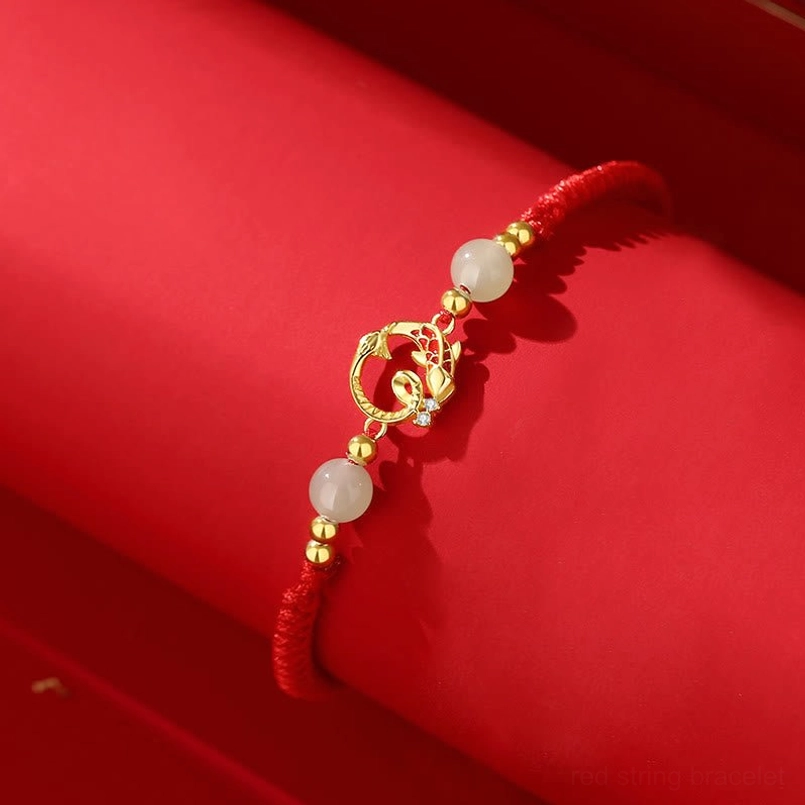 Year of snake protection bracelet with cinnabar and jade beads red cord detail view