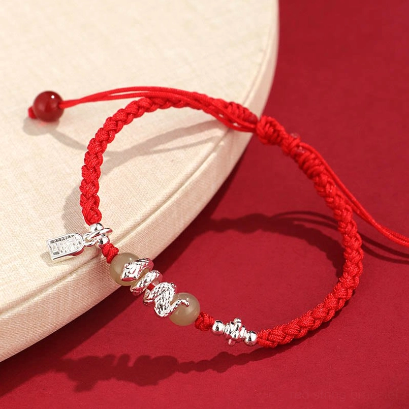 Adjustable snake year red string bracelet side view with sliding knot