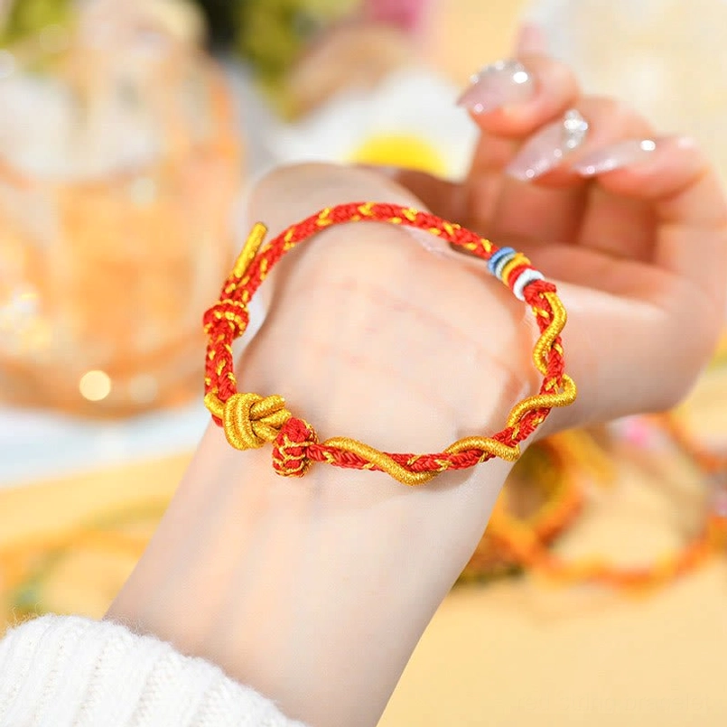 Year of the Snake luck charm bracelet with gold accents and colorful beads