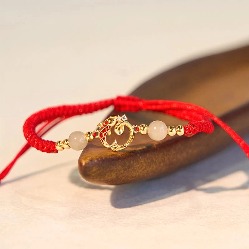 925 sterling silver red string jade bracelet with woven cord and adjustable extension angled view