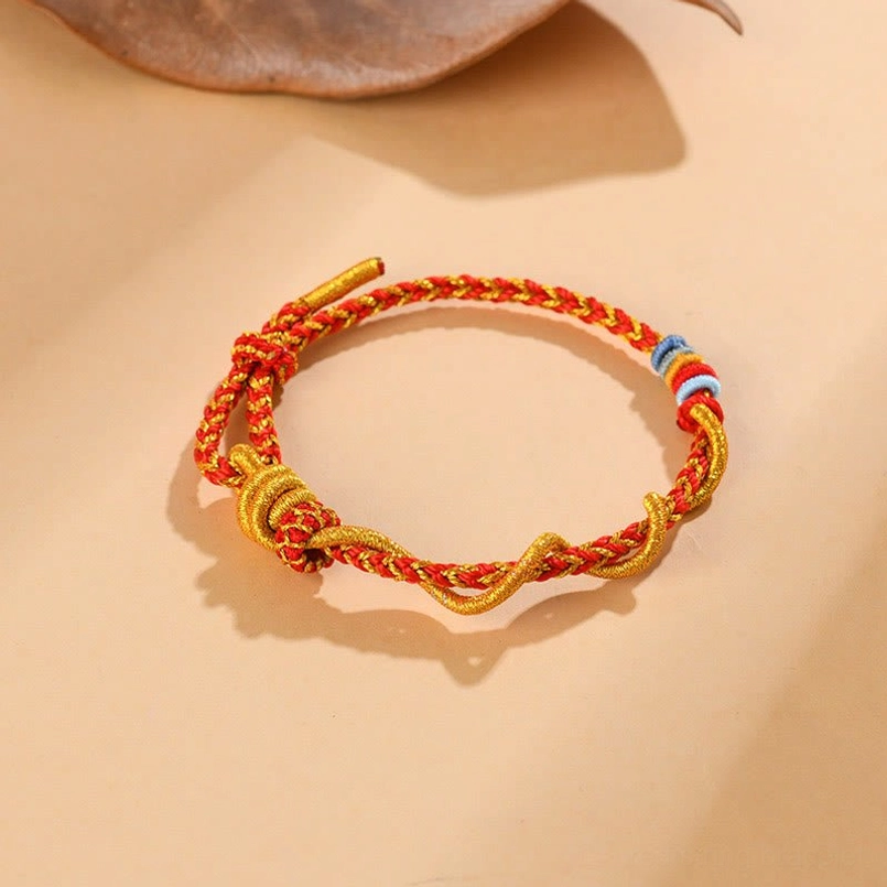 Spiritual red string luck bracelet for Snake astrology sign with protective symbols