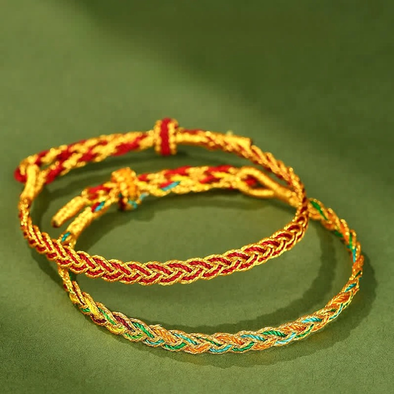 Stacked braided red string bracelets display showing two distinct styles - multicolor and red-gold designs, demonstrating collection variety
