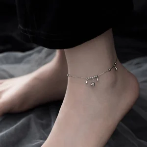 925 sterling silver bell anklet worn on ankle side view