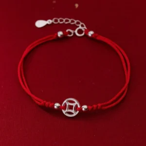 925 sterling silver hollow copper coin red string bracelet front view on dark red background