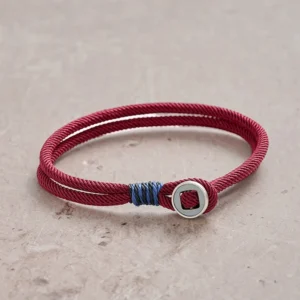 925 sterling silver double wrap protection bracelet with maroon red cord and blue accent, top-down flat lay view