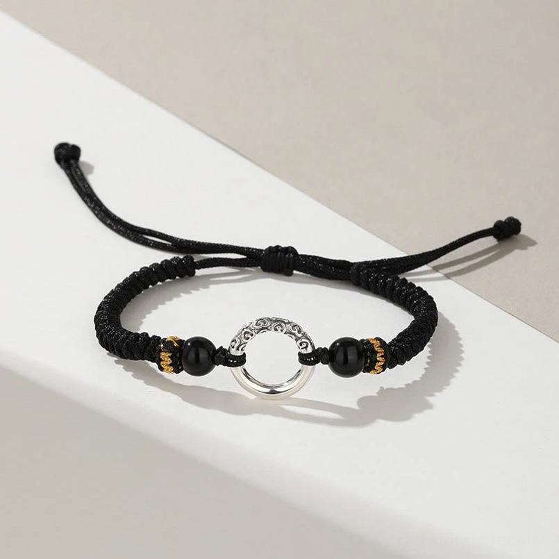 Peace Buckle Auspicious Clouds Bracelet - Top Down Flat Lay Showing Adjustable Pull Knot and Silver Charm