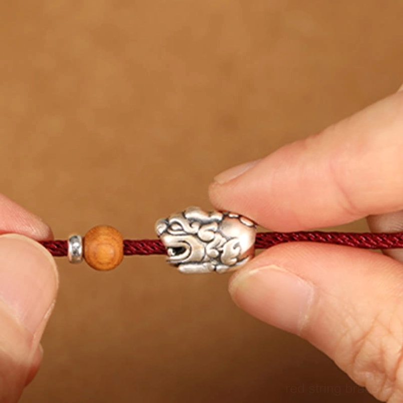Intricately Carved 999 Sterling Silver Pixiu Charm - Close-Up Detail