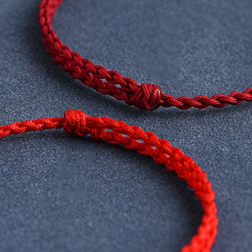 999 sterling silver rabbit charm red string bracelet elegant flat lay