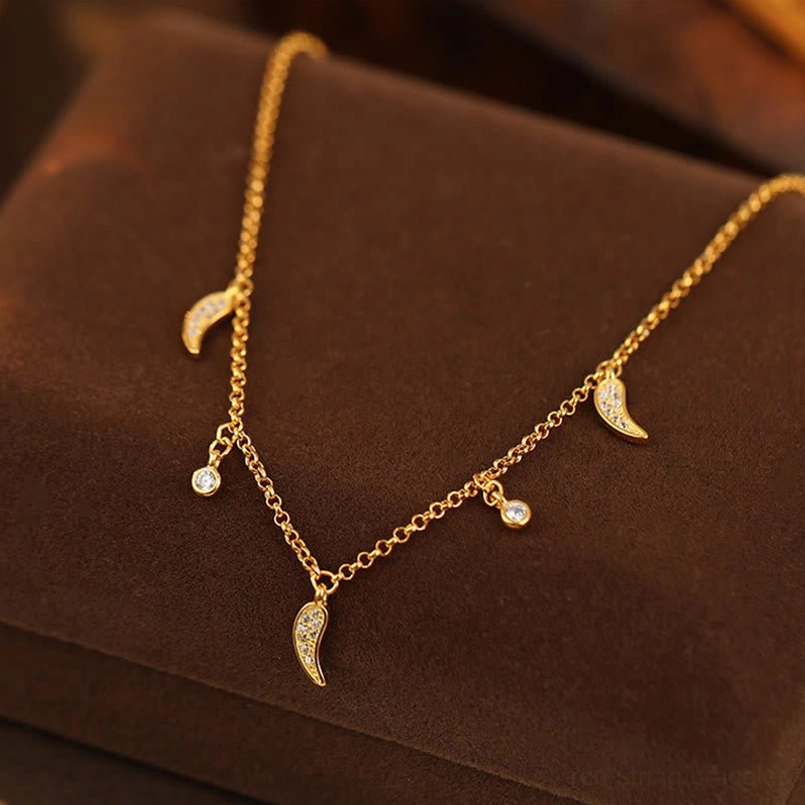 925 sterling silver zircon pepper charm anklet flat lay on velvet - top-down view of Y-shaped charm design