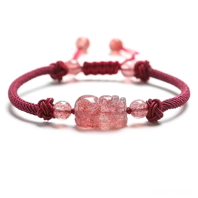 Pixiu red string bracelet top-down overhead view showing symmetrical cord design and focal charm