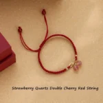 Strawberry quartz endless knot red string bracelet flat lay with adjustable tie closure on light background
