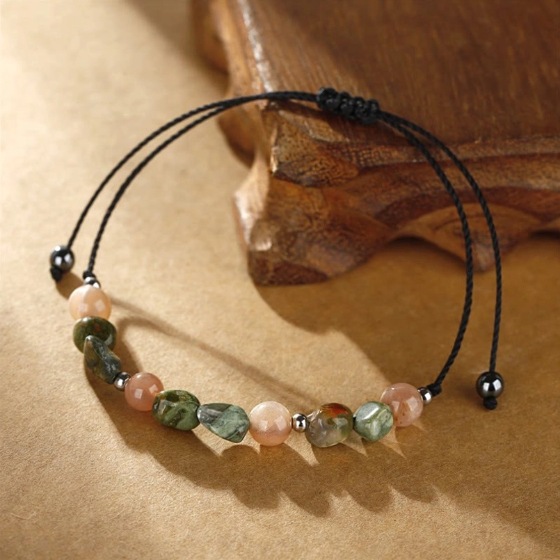 Adjustable waxed cord bracelet flat lay with mixed earth-tone stone beads