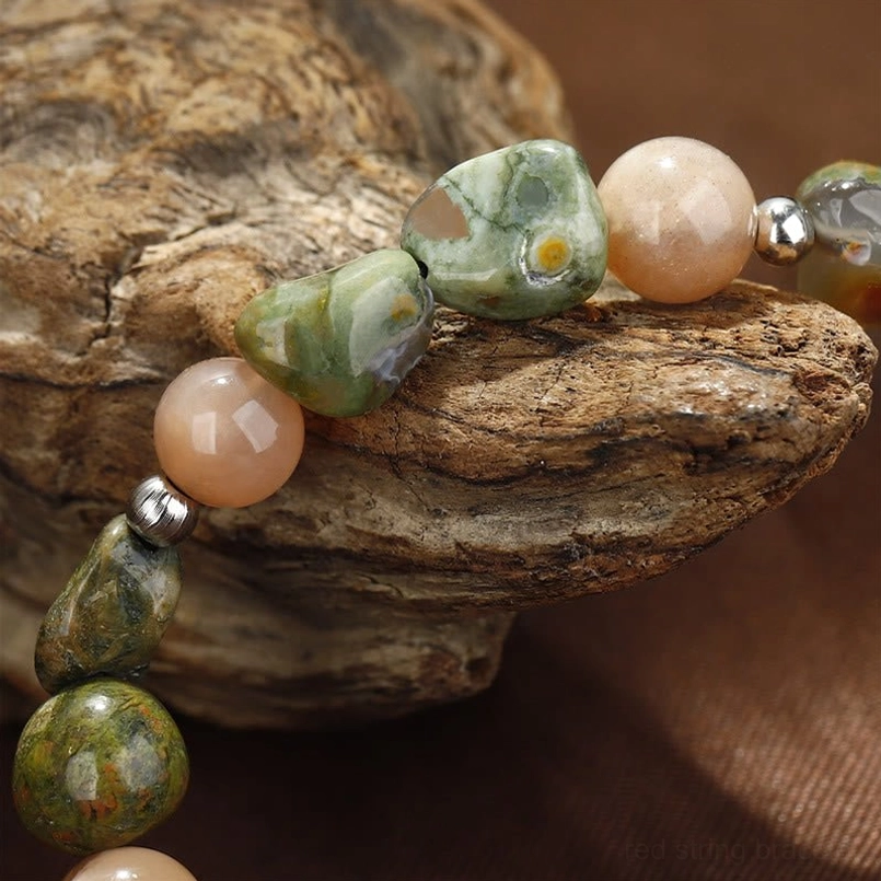 Handmade Sunstone and Rhyolite bracelet detail shot showcasing natural stone texture