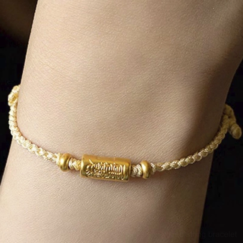 Tan and gold braided lucky bracelet on two wrists - neutral tone wear demo