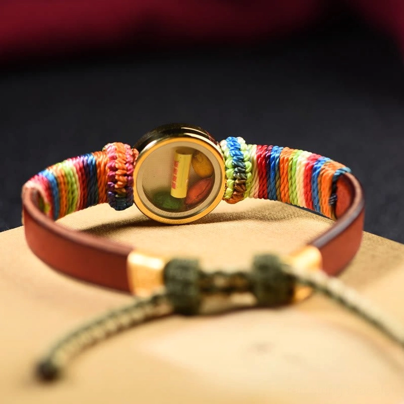 Teal Buddha eye Jambhala blessing bracelet with brown leather strap and adjustable knot