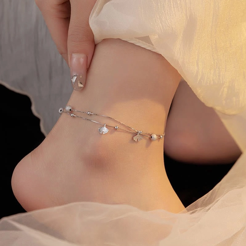 Thin double chain sterling silver ginkgo anklet worn on ankle daily style