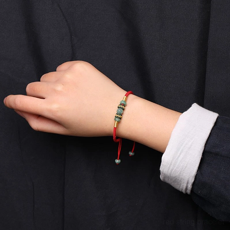 Thin braided jade red string bracelet alternative wearing angle on wrist