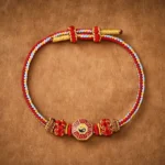 Tibetan Bagua red string bracelet top view flat lay showing multicolor woven cord with yin-yang charm