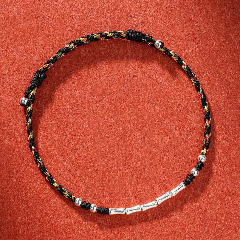 Black Tibetan handmade bamboo protection bracelet with multicolor threads and copper accents