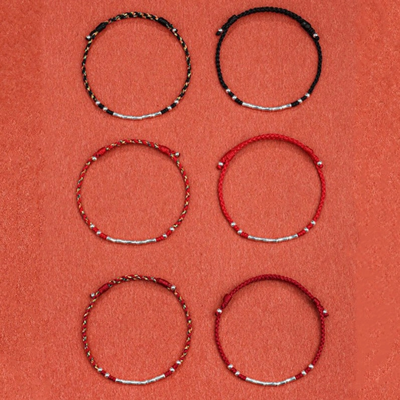 Handmade Tibetan bamboo protection bracelet collection showing various color styles and designs