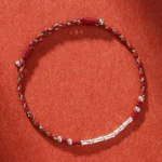Tibetan handmade multicolor bamboo protection bracelet with copper beads and adjustable slip knot closure, overhead view