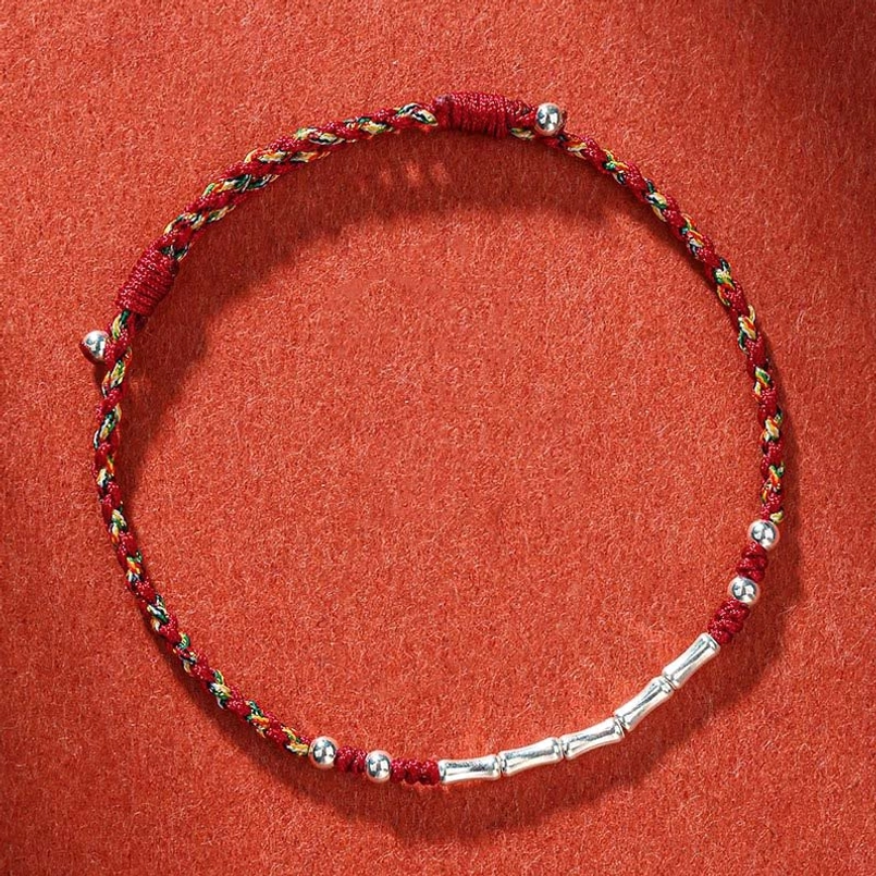 Tibetan handmade multicolor bamboo protection bracelet with copper beads and adjustable slip knot closure, overhead view