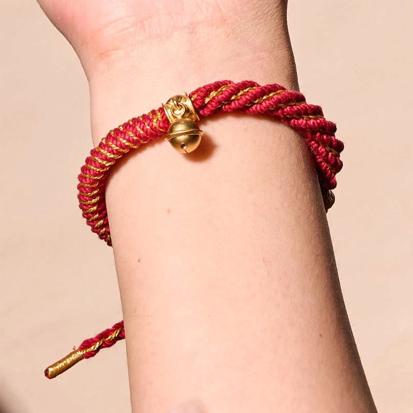 Tibetan amulet bracelet with gold bell and protective charms - adjustable design