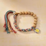 Tibetan Bodhi seed bracelet with colored rope and Zakiram goddess charm - top view