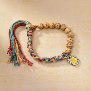 Tibetan Bodhi seed bracelet with colored rope and Zakiram goddess charm - top view