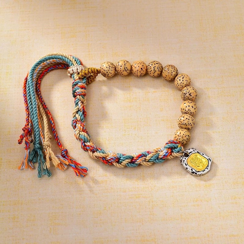 Tibetan Bodhi seed bracelet with colored rope and Zakiram goddess charm - top view