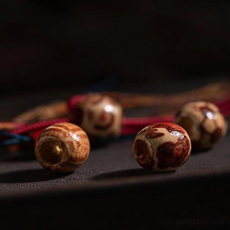 Tibetan koi fish red string bracelet sizing guide showing below 15cm wrist circumference fit